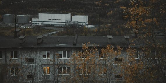Industrial buildings and apartment block in autumn